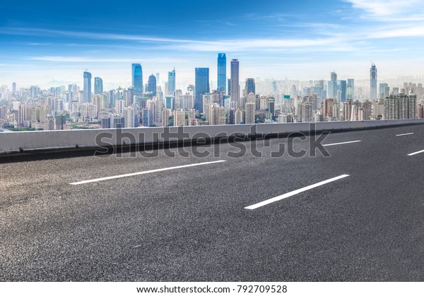Road ground and Chongqing urban architectural\
landscape skyline
