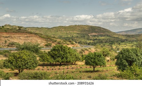 The road from Harar to Jigjiga cutting through a beautiful landscape with lush greenery surrounded by mountains