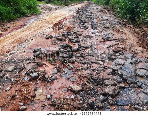 Road\
has damaged after flooding, country road damaged\
