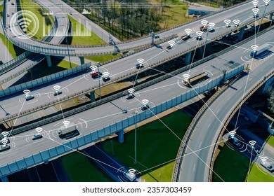 Road junction with cars. Satellite navigation for transport. Road trestle view from quadrocopter. Navigation technologies. Cars are connected by lines. Satellite navigation for traffic management