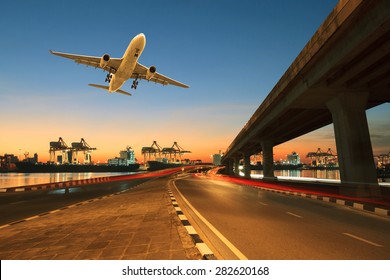road ,land bridge run into ship port and commercial cargo plane flying above use for land ,air and vessel transport industry business