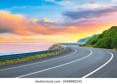 road landscape on summer in sunset. highway landscape at colorful sunset. Road view on the beach in summertime. colorful seascape with beautiful road scenery. Highway view on beach for vacation travel - Powered by Shutterstock