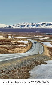 Road leading into the distance in Iceland, van on the road