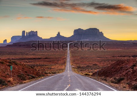A road leading to Monument Valley at sunset.