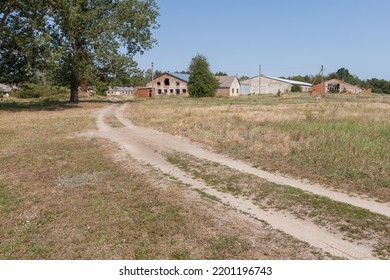The road leading to the ruins of an abandoned farm - Shutterstock ID 2201196743