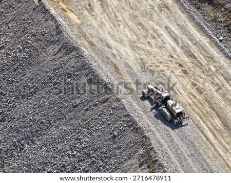 road leveling and compaction process using heavy machinery motor grader