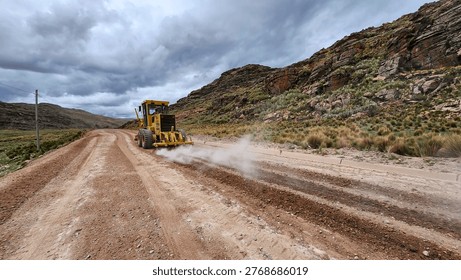 Road leveling and scarifying process using motor grader machinery
