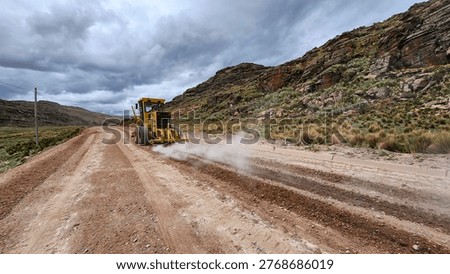 Road leveling and scarifying process using motor grader machinery
