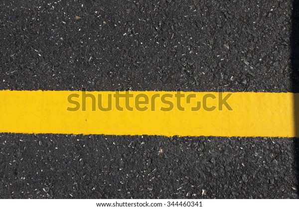 Road line yellow close up / new mark yellow line\
reflex on road