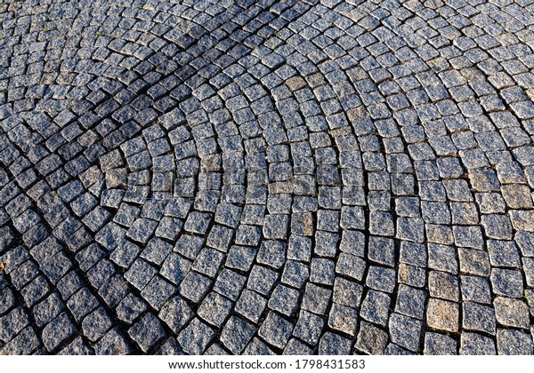 a road made of cobblestones, just like\
in the old days, for people and cars to\
move
