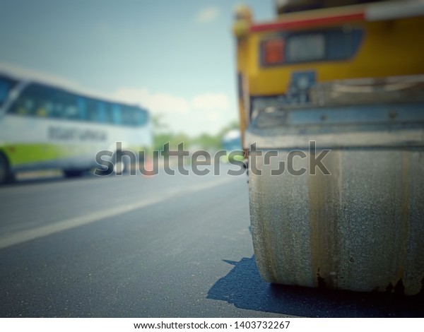 Road maintenance by burning old materials and\
improving quality, blurred\
images