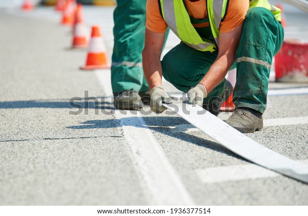 Road marking - Crosswalk painting, white painting on\
asphalt road