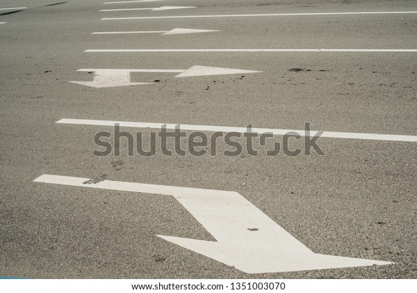 road marking in white\
paint on the way