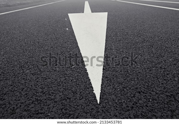 Road markings. The direction of movement is\
indicated by the arrow. Close\
up