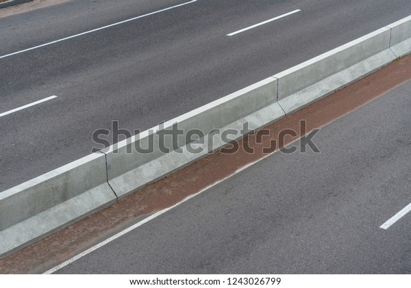 Road with markings and the separation barrier\
\