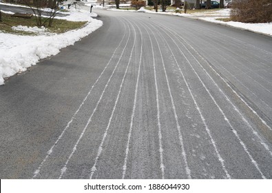 Road With Melting Salt Spread Before Snow Storm        