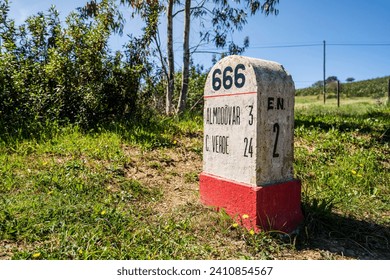 Road milestone indicating 666th kilometer on famous national road N2 going across Portugal
