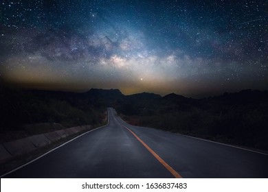 Road And Milky Way With Mountain At Night.