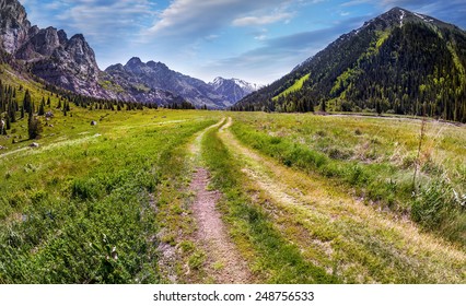 Road in Mountain valley at blue sky in Dzungarian Alatau, Kazakhstan, Central Asia - Shutterstock ID 248756533