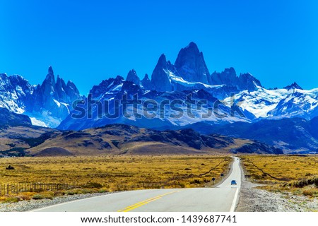 The road to the mountains. The border area between Argentina and Chile. Highway through the desert Patagonia goes to the magnificent mountain range Fitzroy. The concept of extreme, active tourism