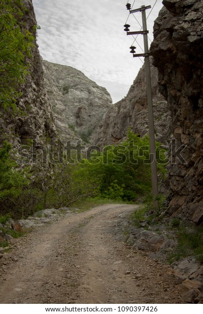 road in the\
mountains, a path for people and\
cars