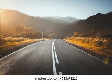 Road In Mountains. Sunset.