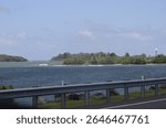 Road in the municipality of Dorado, Puerto Rico. There are beaches, palm trees, and other things to make for a fun day.