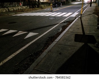 Road At Night With Crosswalk