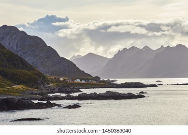 The road from Nyksund Vesterålen along the fjord with several layers of mountains 