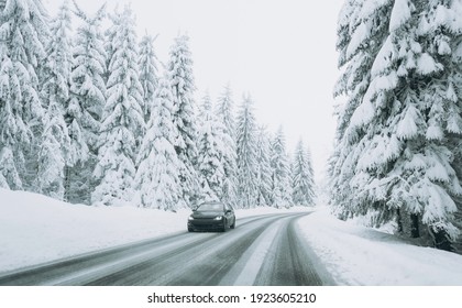 A Road On The Background Of A Beautiful Winter Snow-covered Landscape.Family Trip, Vacation, Adventure. Driving A Car In Extreme Winter Conditions.Travel Concept Background