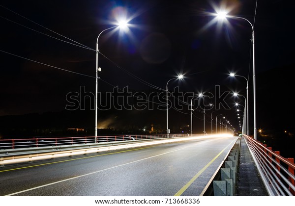 The road on the bridge with lamps, the night
picture on long endurance