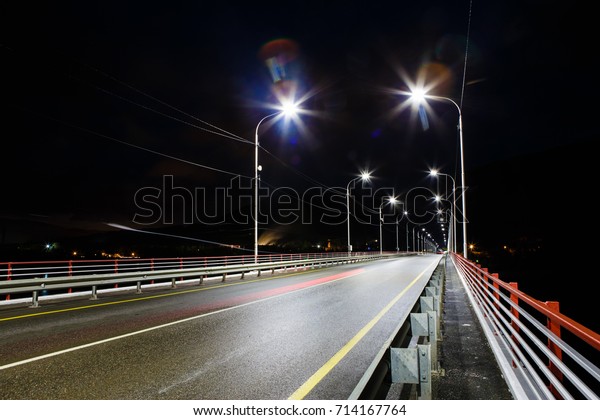 The road on the bridge with lamps, the night\
picture on long endurance
