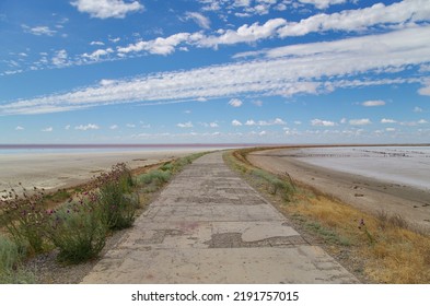 Road On Dam On Salt Lake Elton. Is 18 M Below Sea Level. Is Largest Mineral Lake In Europe And One Of Most Mineralized In World. Russia, Volgograd Oblast