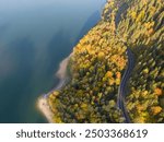 road on the edge of a lake, autumn ,in the Romanian mountains seen from above, Romania, Bucovina