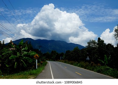 The road on mountain in the clouds background.