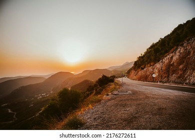 A road on the mountain on the sunset - Shutterstock ID 2176272611