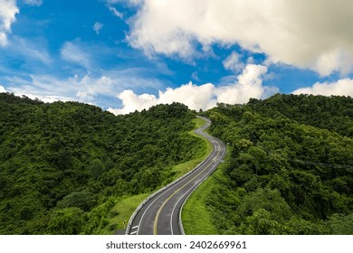 Road on mountain which a lot of road curve very popular landmark for tourist in Nan province, Thailand. - Powered by Shutterstock