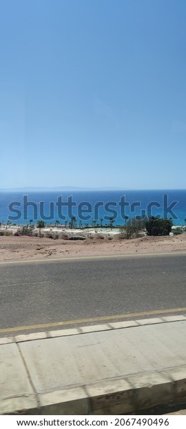 road\
overlooking the sea and mountains. road\
egypt