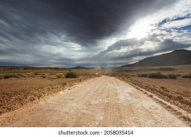 Road in the prairie country. Deserted natural travel background. - Shutterstock ID 2058035414