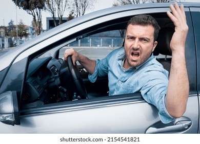 Road Rage Man At The Wheel Threatening Other Drivers