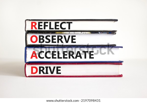 ROAD reflect observe accelerate drive symbol.\
Concept words ROAD reflect observe accelerate drive on books on\
white background. Business ROAD reflect observe accelerate drive\
concept. Copy space.