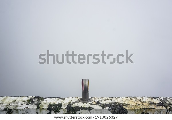 Road\
reflectors on a barrier on a mountain\
road