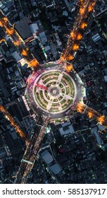 Road Roundabout With Car Lots Wongwian Yai In Bangkok,Thailand. Street Large Beautiful Downtown At Night Light.  Aerial View , Top View ,cityscape ,Rush Hour Traffic Jam