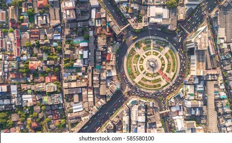 Road Roundabout With Car Lots Wongwian Yai In Bangkok,Thailand. Street Large Beautiful Downtown At Evening Light.  Aerial View , Top View ,cityscape ,Rush Hour Traffic Jam