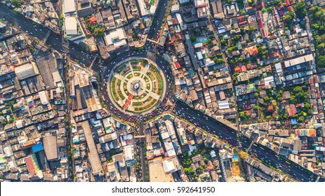 Road Roundabout With Car Lots Wongwian Yai In Bangkok,Thailand. Street Large Beautiful Downtown At Evening Light.  Aerial View , Top View ,cityscape ,Rush Hour Traffic Jam