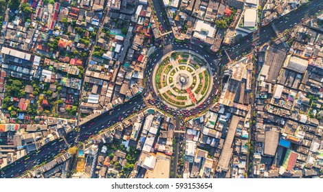 Road Roundabout With Car Lots Wongwian Yai In Bangkok,Thailand. Street Large Beautiful Downtown At Evening Light.  Aerial View , Top View ,cityscape ,Rush Hour Traffic Jam