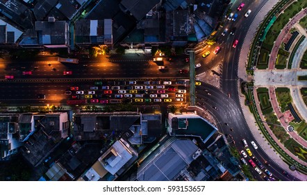 Road roundabout with car lots Wongwian Yai in Bangkok,Thailand. street large beautiful downtown at evening light.  Aerial view , Top view ,cityscape ,Rush hour traffic jam
