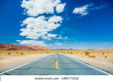 A Road Running Through The Scenery With Extreme Heat Haze During Summer In Death Valley National Park