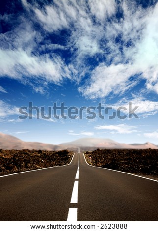 road in a rural area with a nice sky