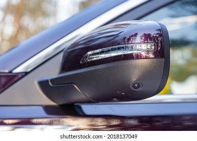 Road Safety. 360 Terrain System Option In A Modern Car. Close-up Side View Rearview Mirror Of Modern Car With Round View Camera